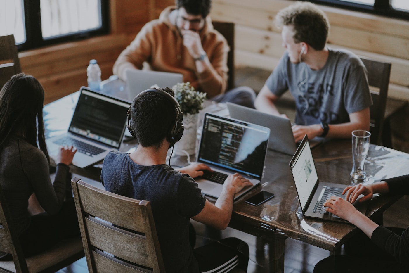 Team collaborating on project delivery in modern office